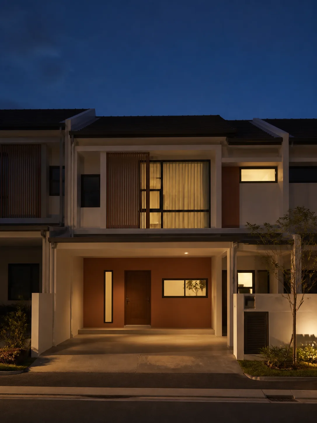 Terrace house at night with warm smart lighting